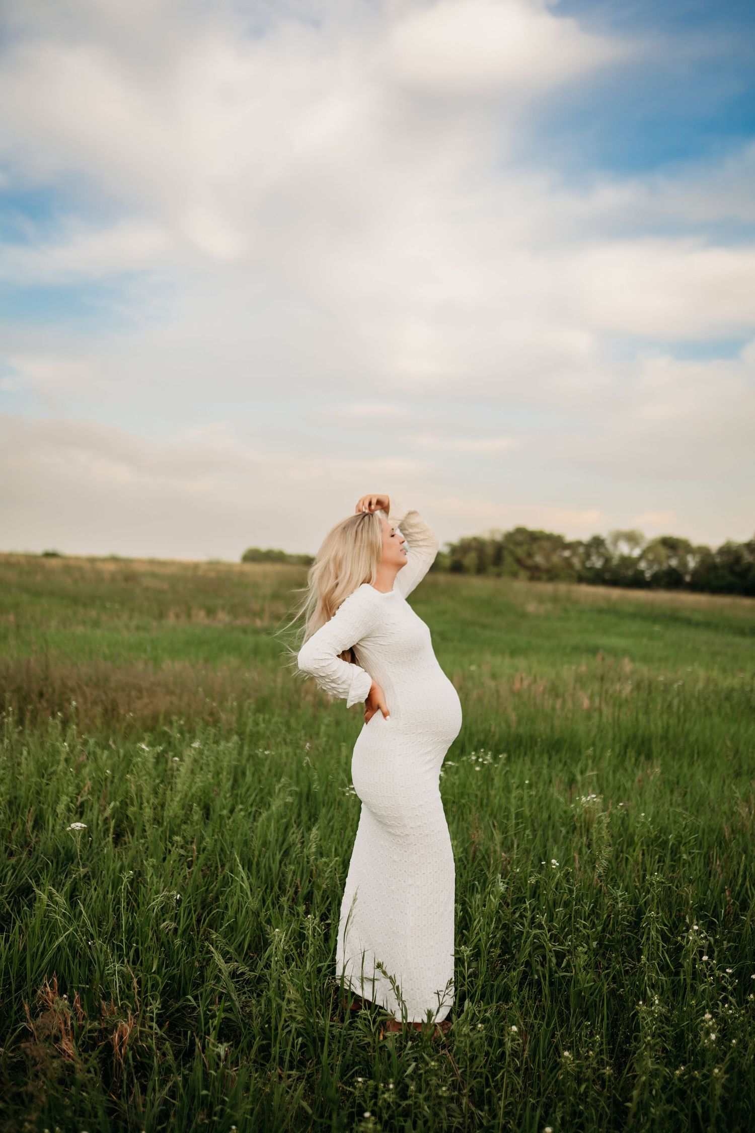 Maternity photography session capturing expecting mother in soft natural light