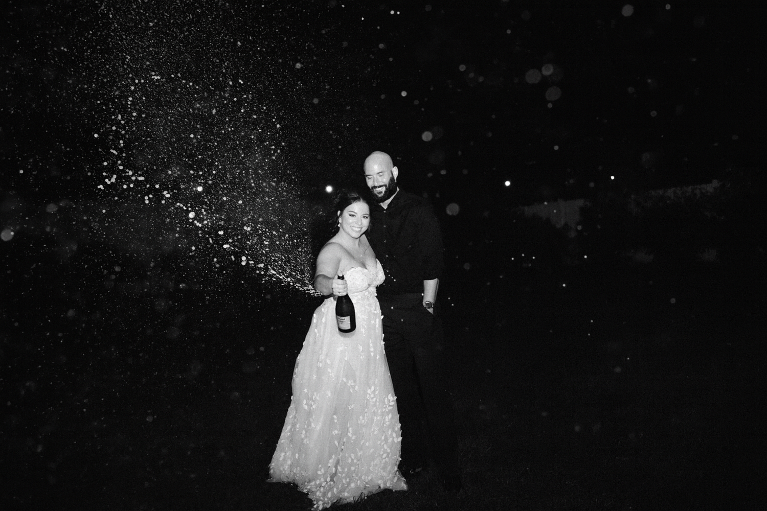 Lawrence Kansas wedding photographer capturing bride and groom walking together