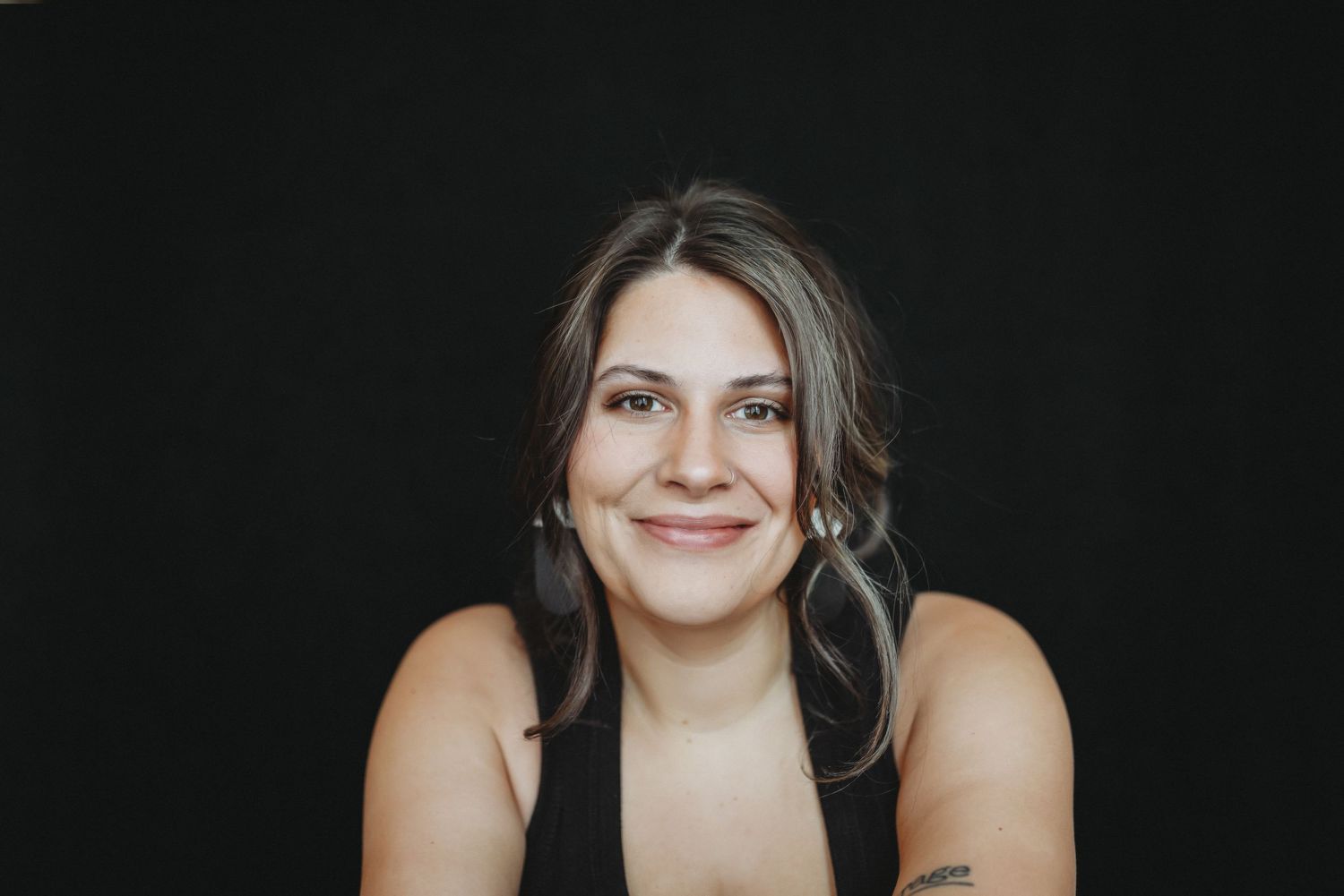 Woman smiling during Lawrence Kansas portrait photography session