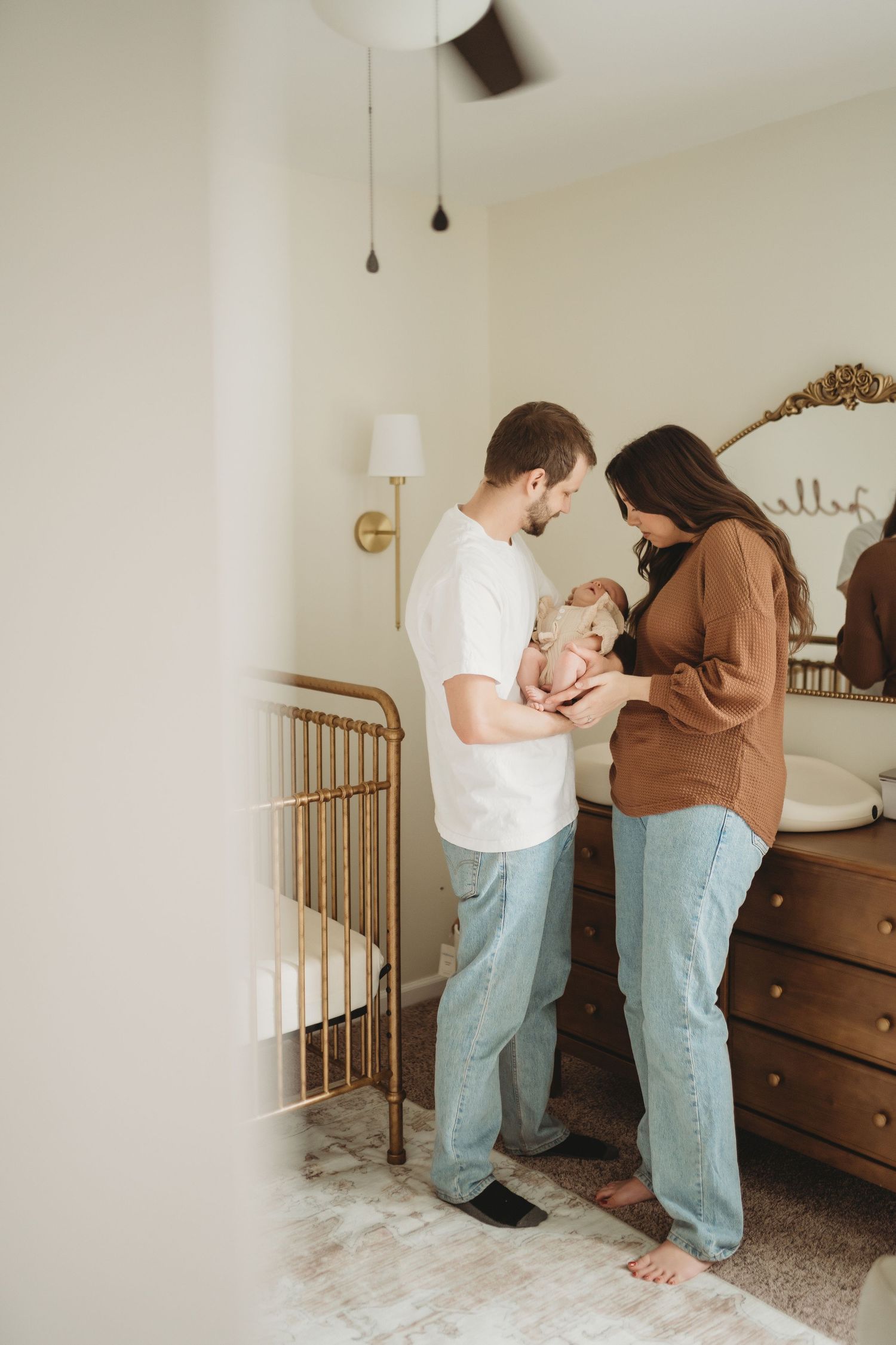 Lawrence Kansas newborn photographer capturing baby wrapped in blanket