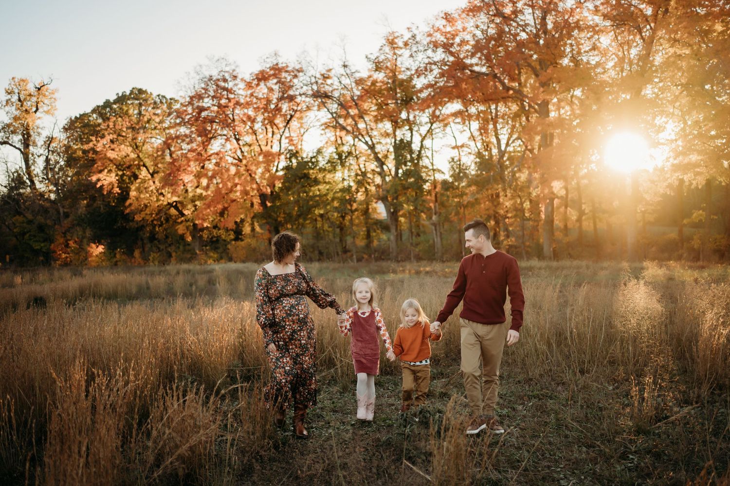 Family laughing together during Lawrence Kansas family photography session