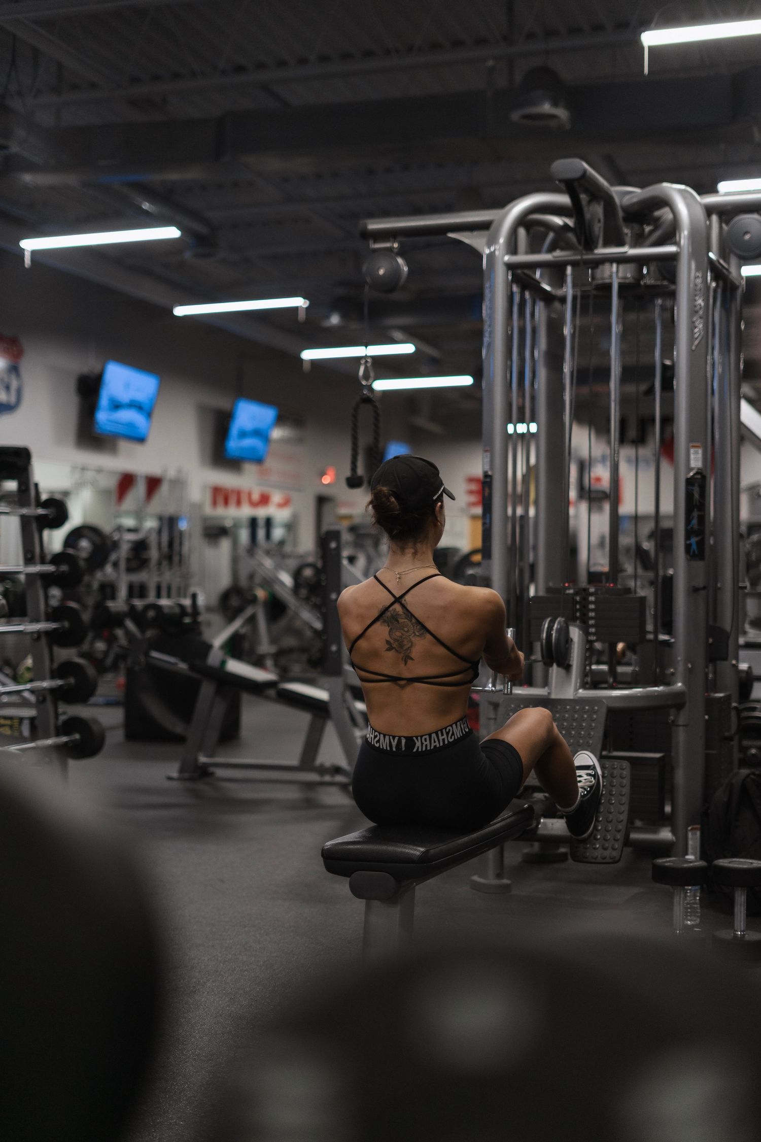 Bodybuilder working out back.