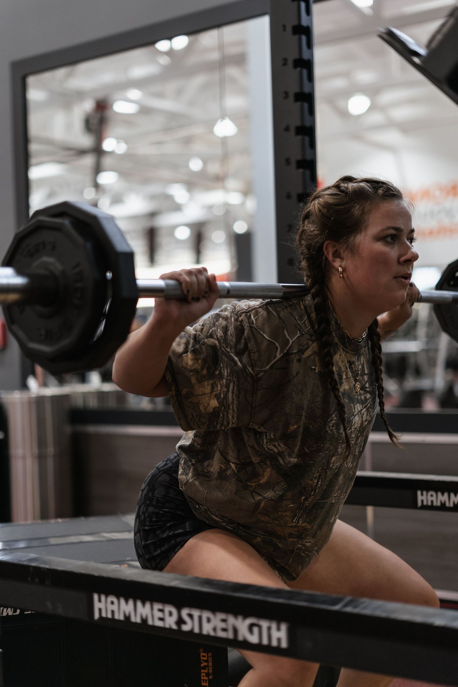 Athlete squatting with a barbell.