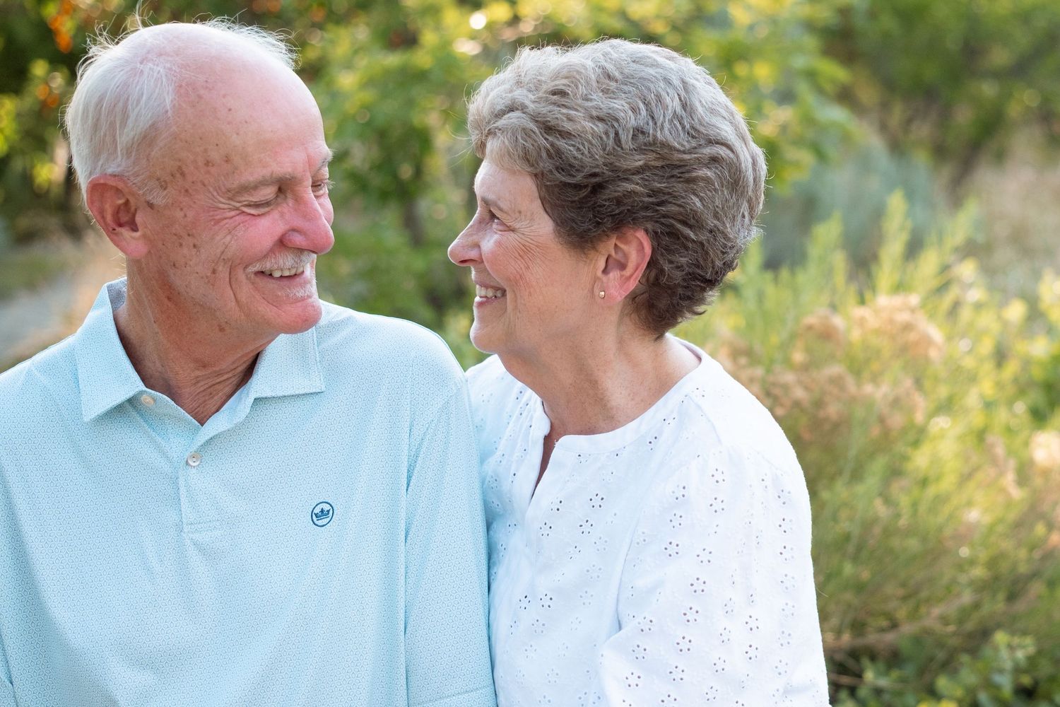 Close up of elderly couple gazing at one another.