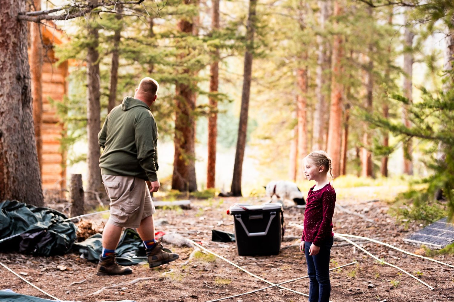 Documentary portraits of family putting together tent in mountains of Colorado.