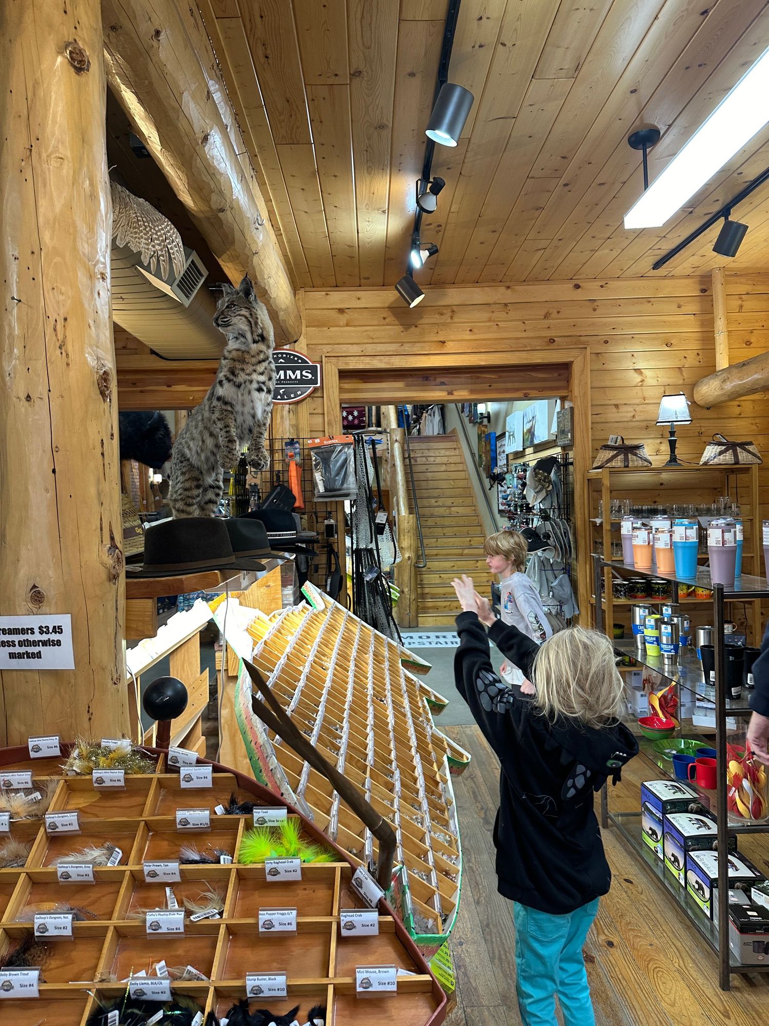 Two children visiting Kirk's Fly shop in Estes Park, Colorado.