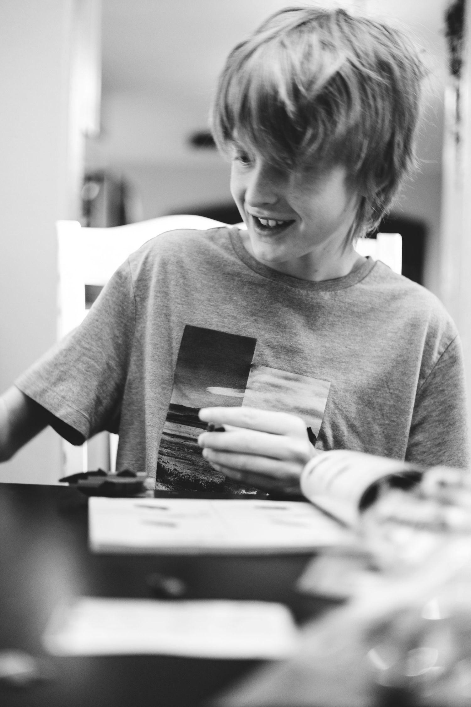 Project 365 - black and white of boy playing cards.