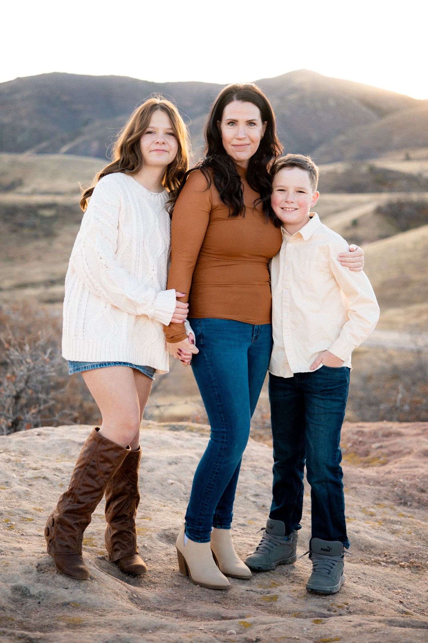 Mother standing posed with two children at South Valley Park near Denver, Colorado.