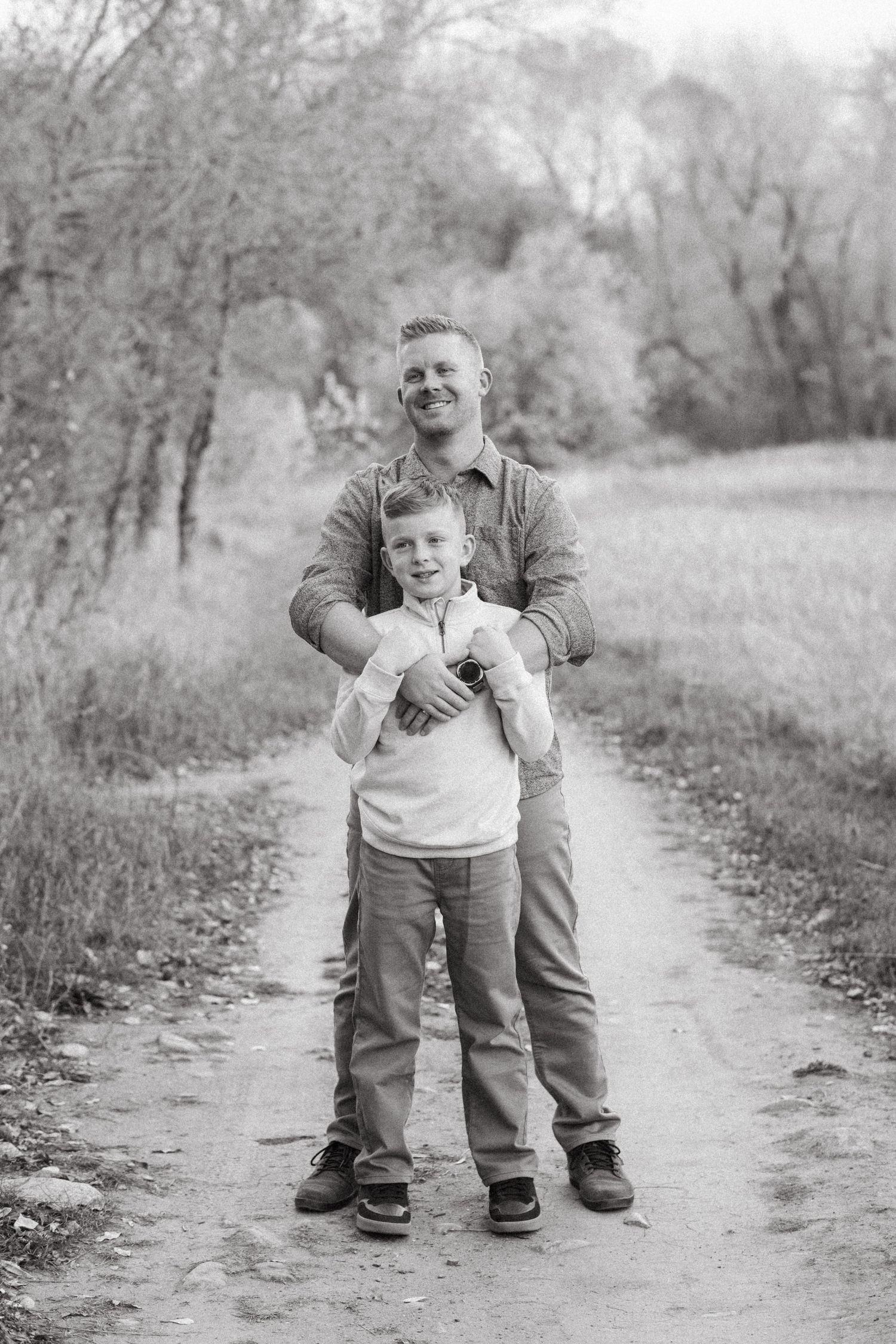 Father and son on walking path at Bear Creek Lake Park, in Lakewood.