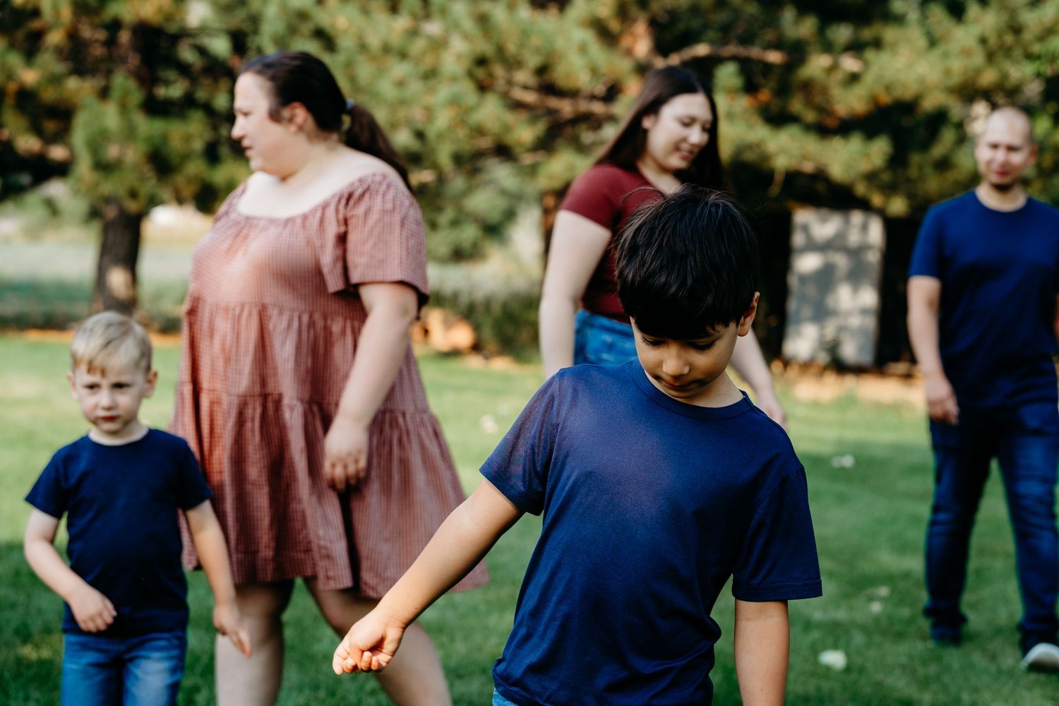 Documentary portrait of family of five walking on family property in Golden, Colorado.