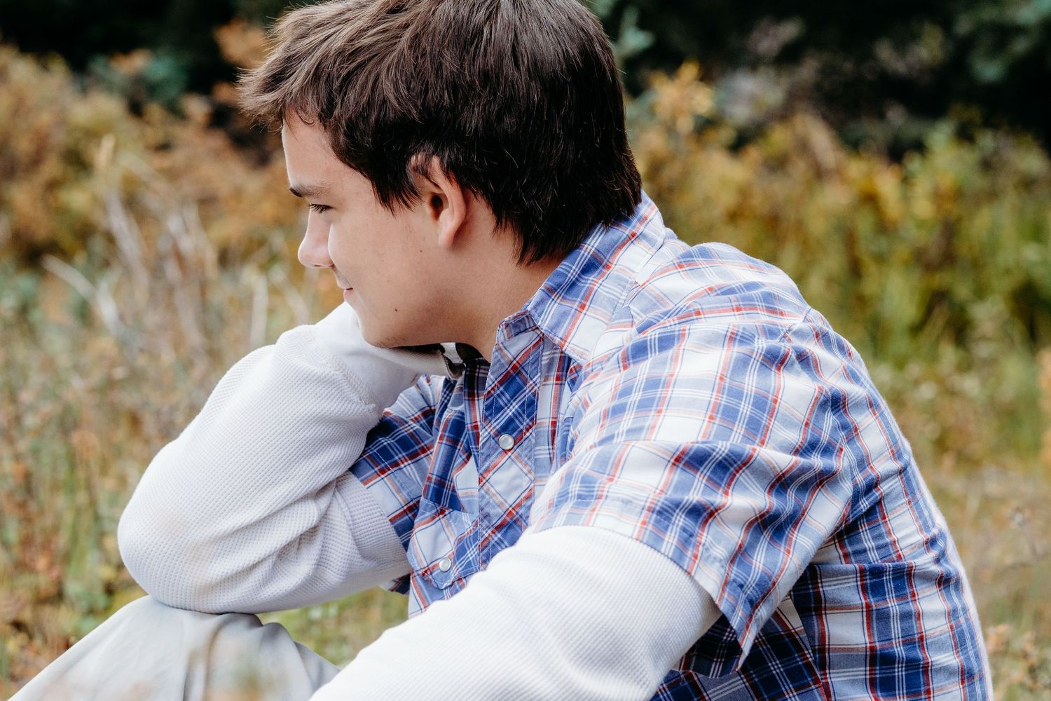 Close up of teen boy looking away.