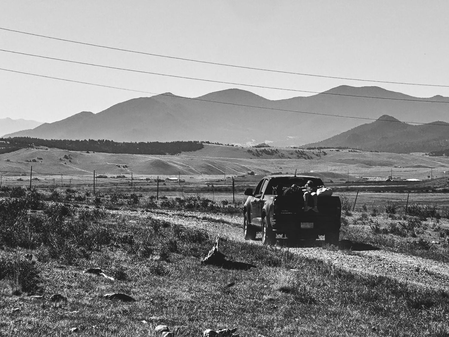 Denver photographer's project 365, June, black and white of truck driving toward mountains.