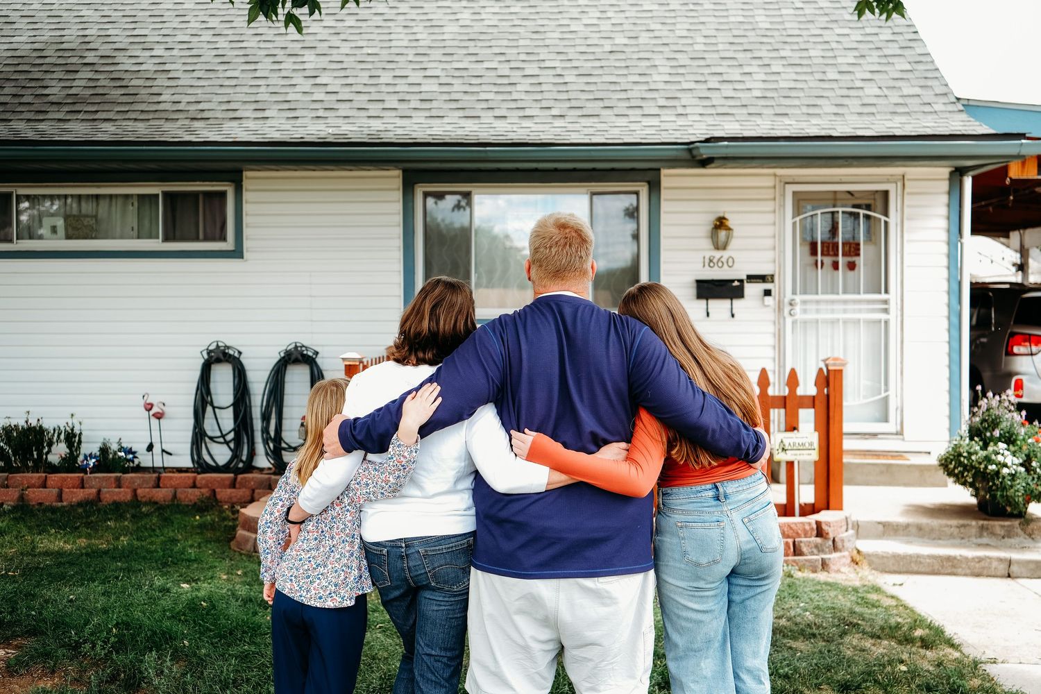 In-home Denver family photography session,  family of four in front yard of Denver home.