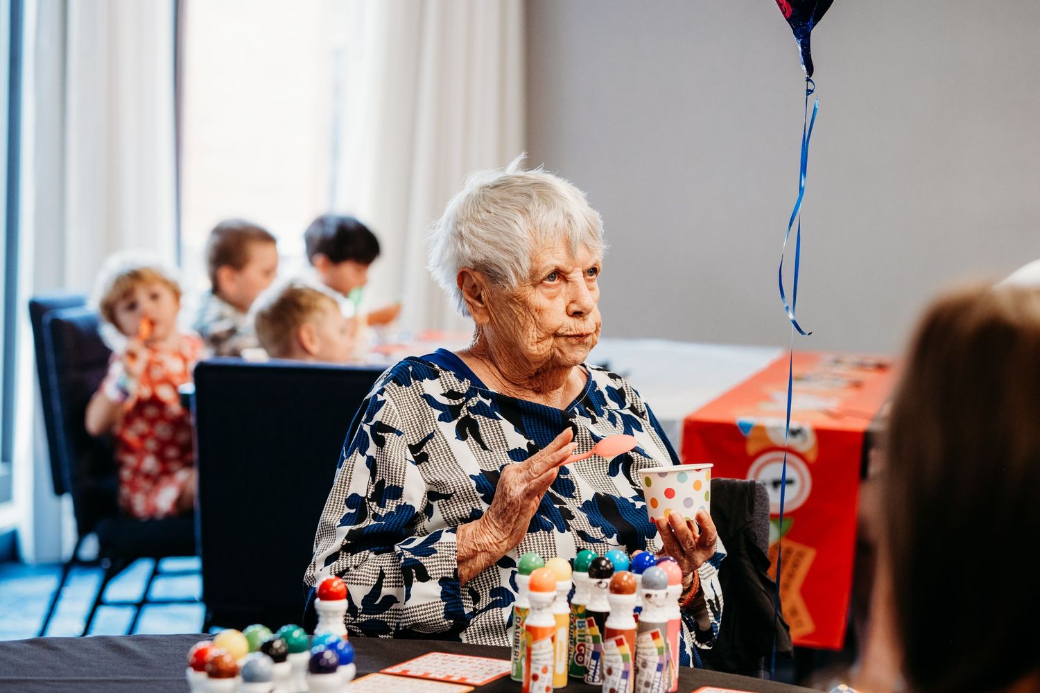 Grandma enjoying ice cream at her 90th birthday party.