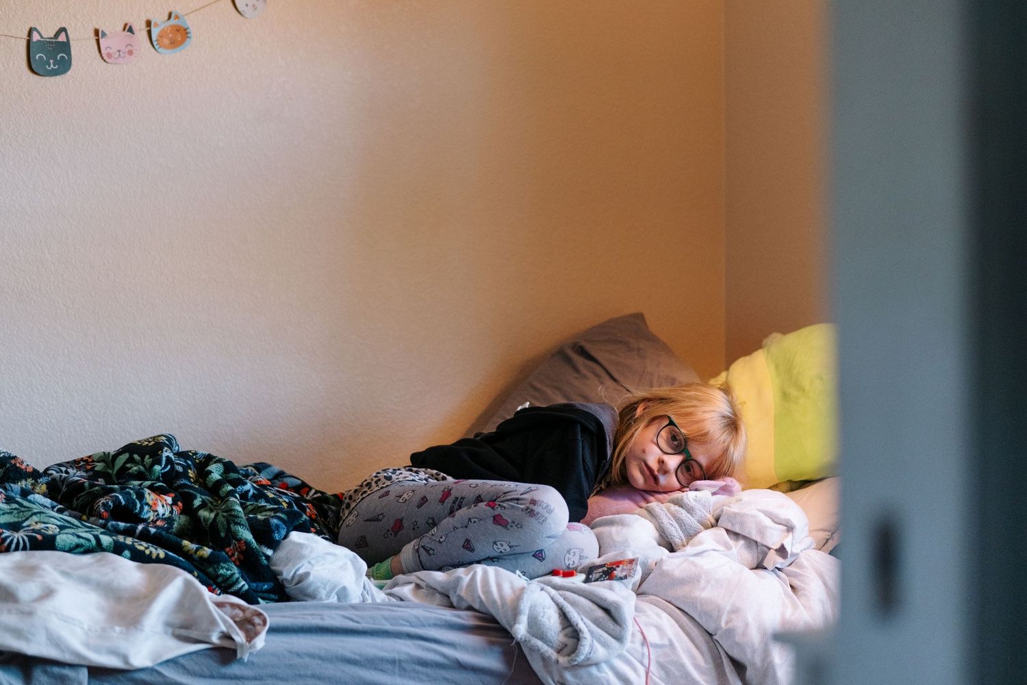Girl laying in bed.