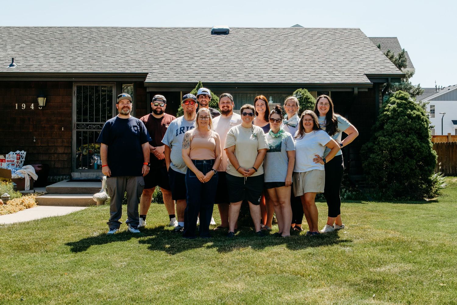 Denver photographer's project 365, June, group of adult cousins standing in front of their grandmother's home.