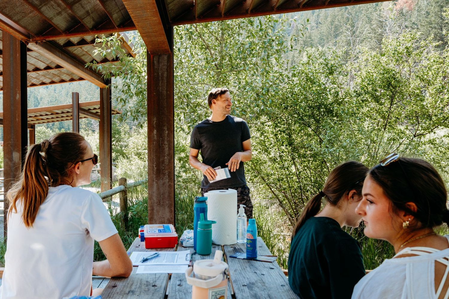Pacey, cofounder of WILD, teaching about Larkspur and other native plants found off the Clear Creek Trail.