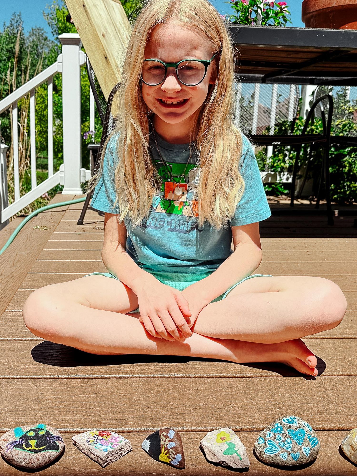 Denver photographer's project 365, June, girl with painted rock collection.