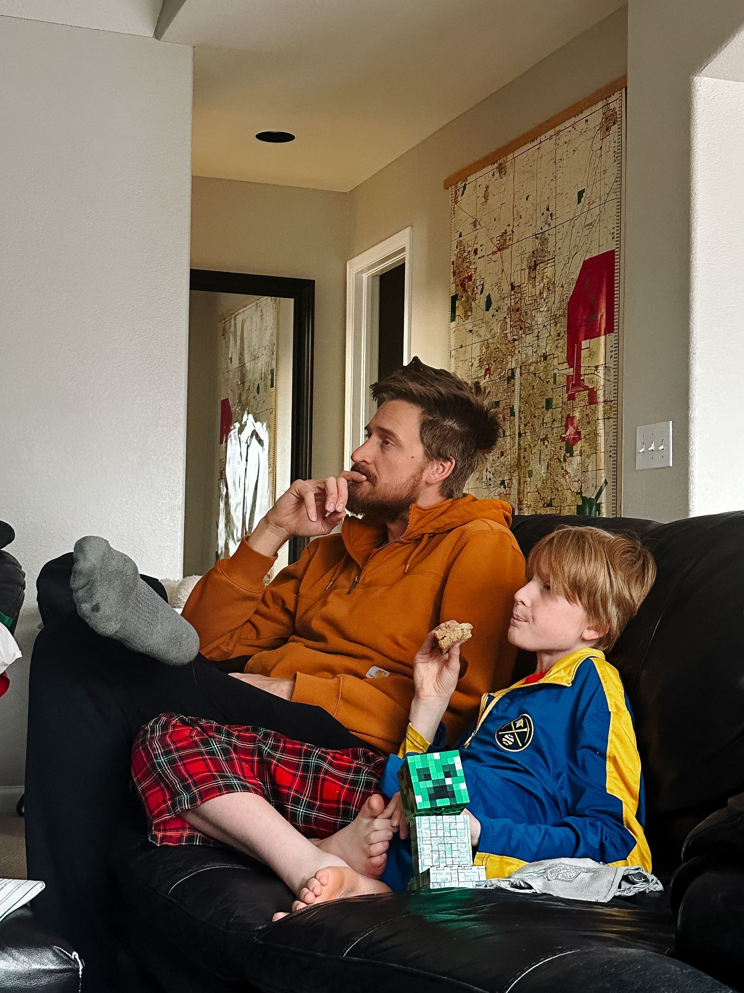 Project 365 - father and son watching basketball game on TV.
