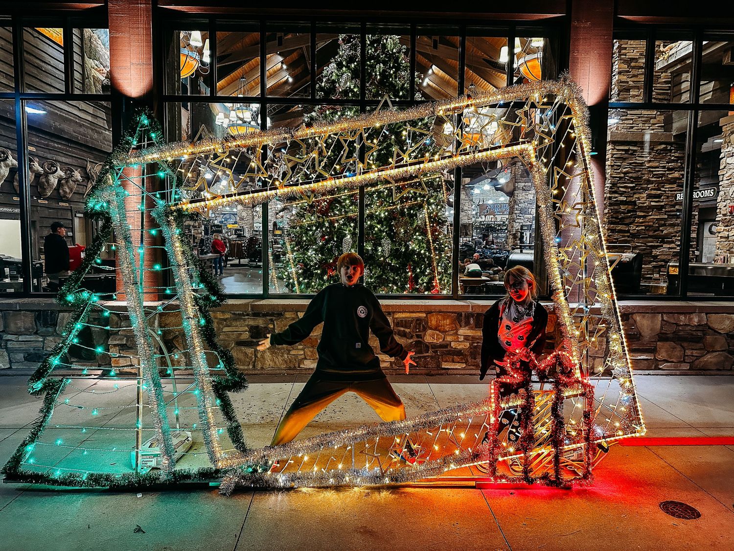 Project 365 - kids playing at holiday light up decoration