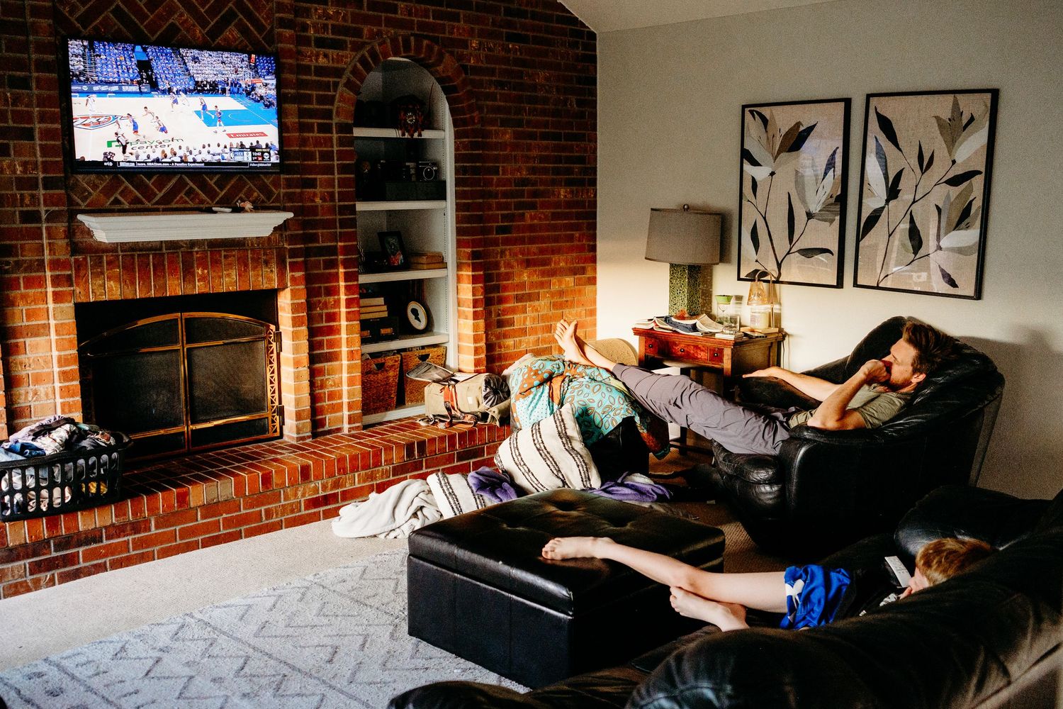 Denver photographer's project 365, May, father and son lounging in den, watching television.
