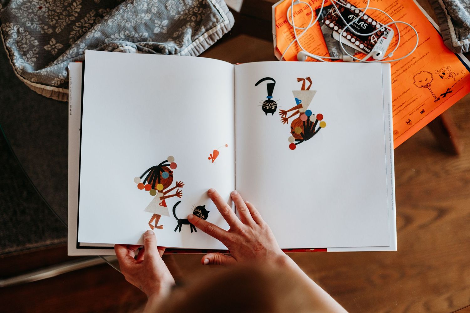 Close up of child looking through wordless picture book.