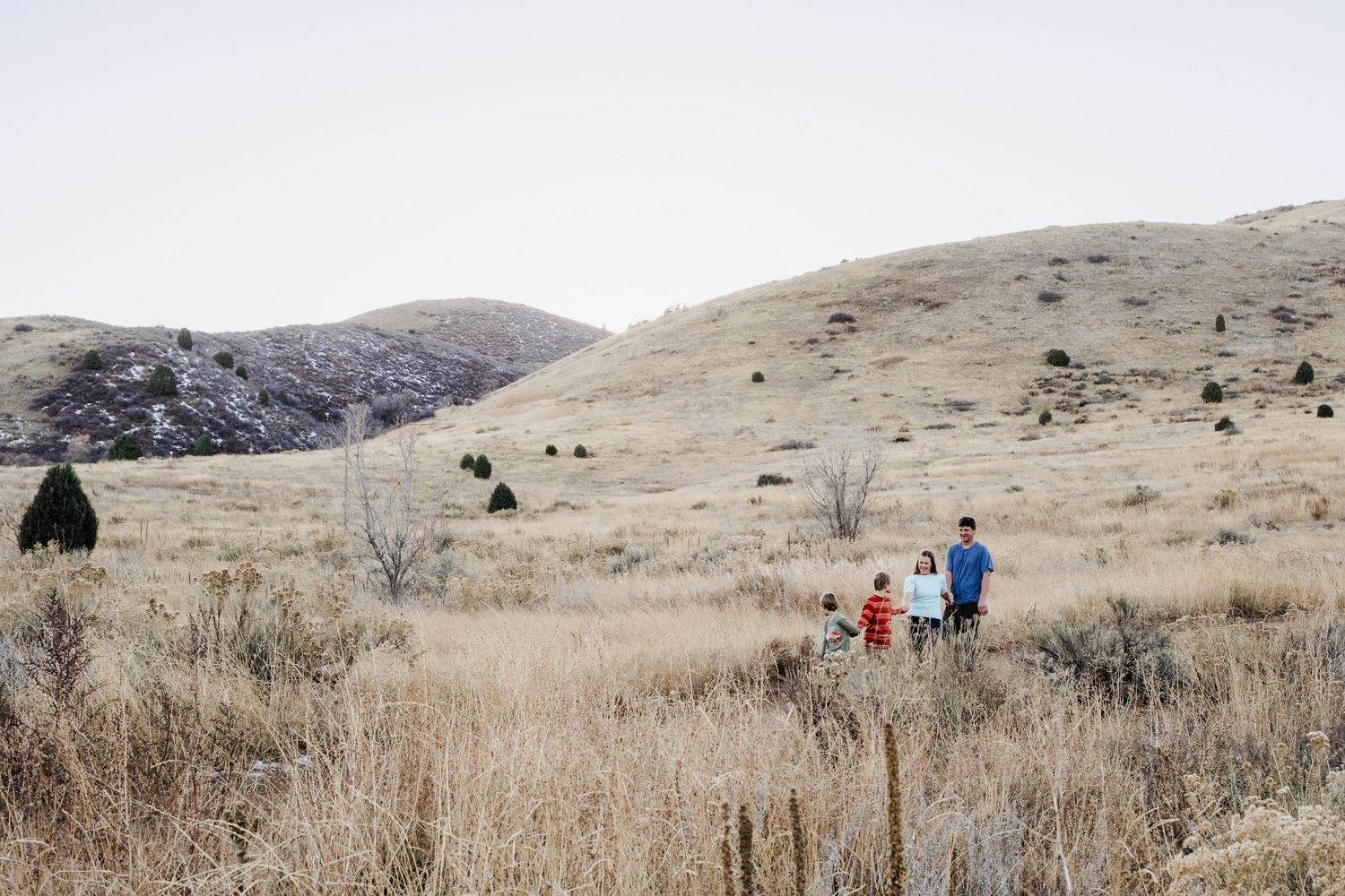 Family walking on trail at Matthews Winter Park in Golden, CO.