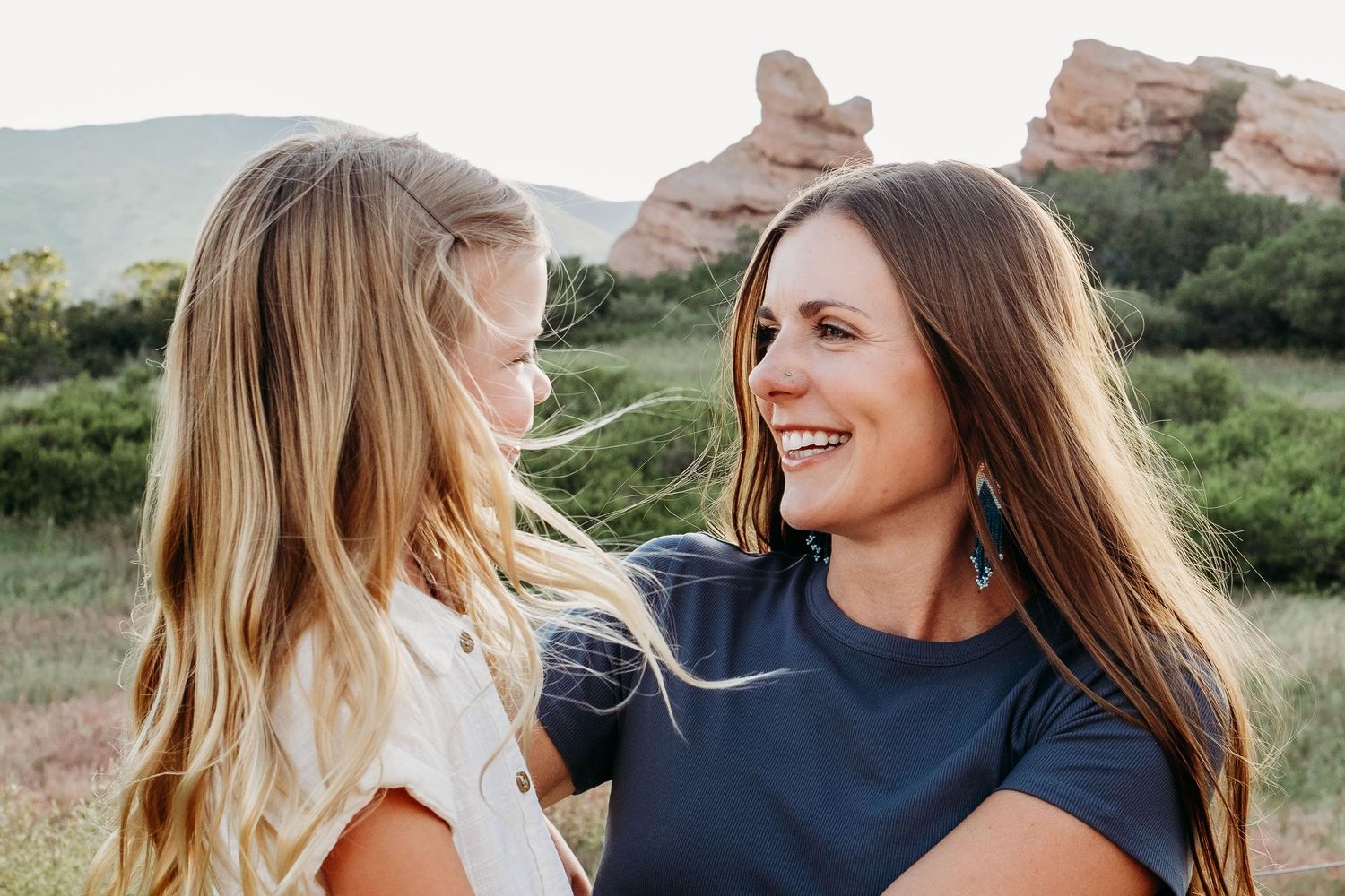 Candid playful portrait of mother and daughter at South Valley Park.