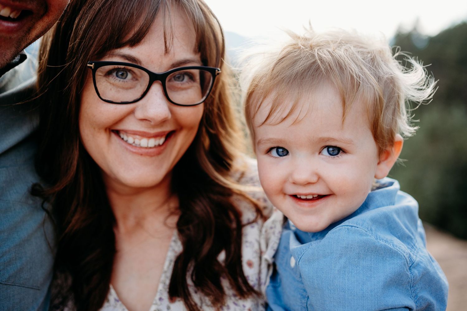 Close up of mom and young son smiling at Mount Falcon West family photo session.
