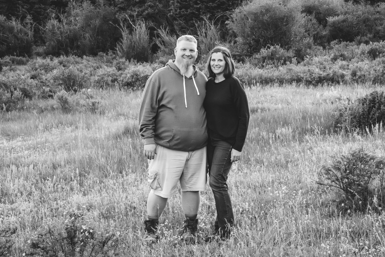 Black and white portrait of adult couple in mountains of Jefferson, Colorado.