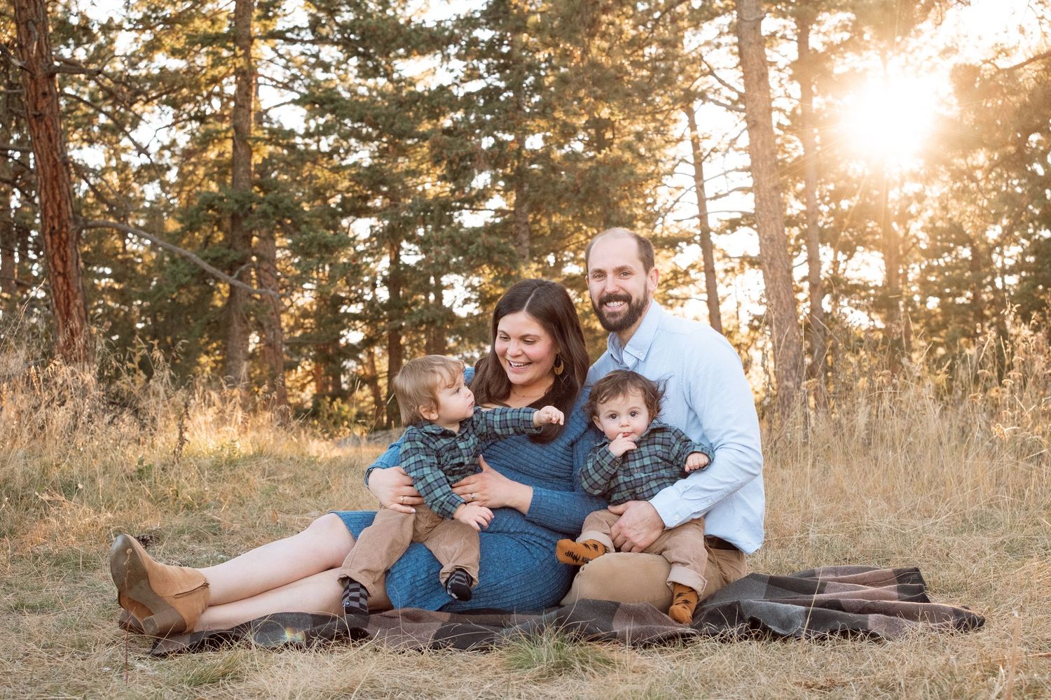 Family photo of mother, father and twin boys with Denver family photographer at Mt Falcon West.