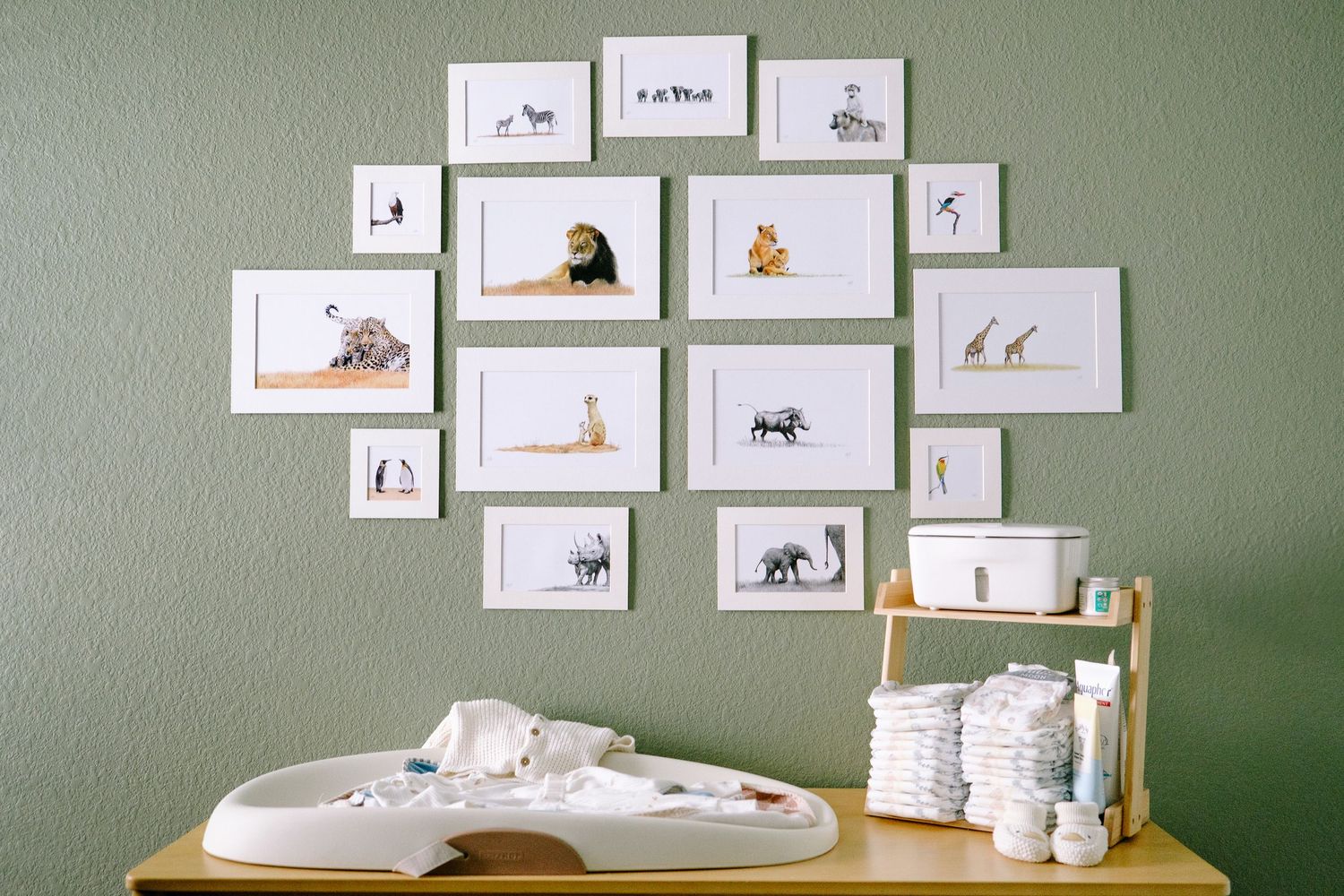 Nursery details of framed pictures of African animals during Denver in-home photo session
