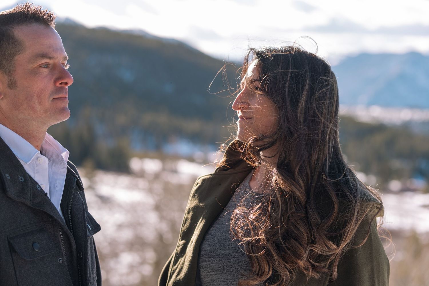 Editorial styled portrait of engaged couple looking serious near Breckenridge, Colorado during engagement photo session.