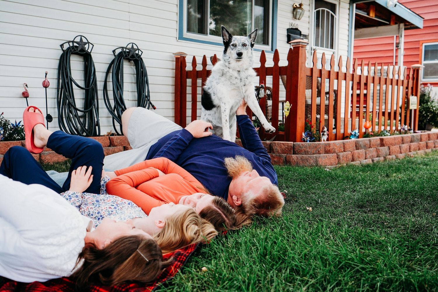In-home Denver family photography session,  family of four in front yard of Denver home.