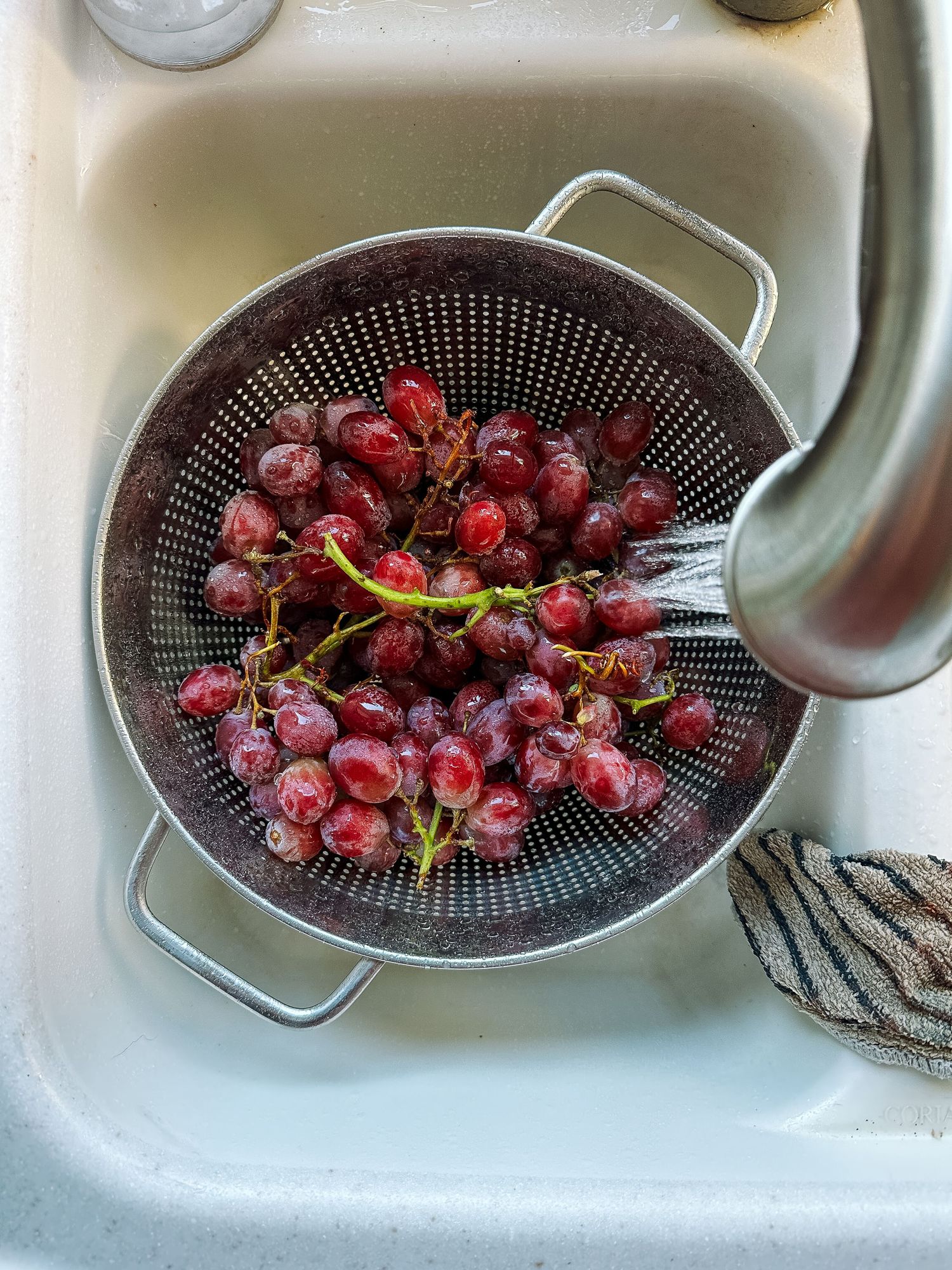 Project 365 photo - overhead view of washing grapes in a sink.