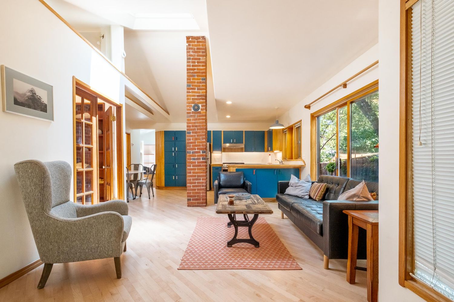 Airbnb photo Denver Colorado professional Denver photographer, brickwork and view of living area and kitchen.