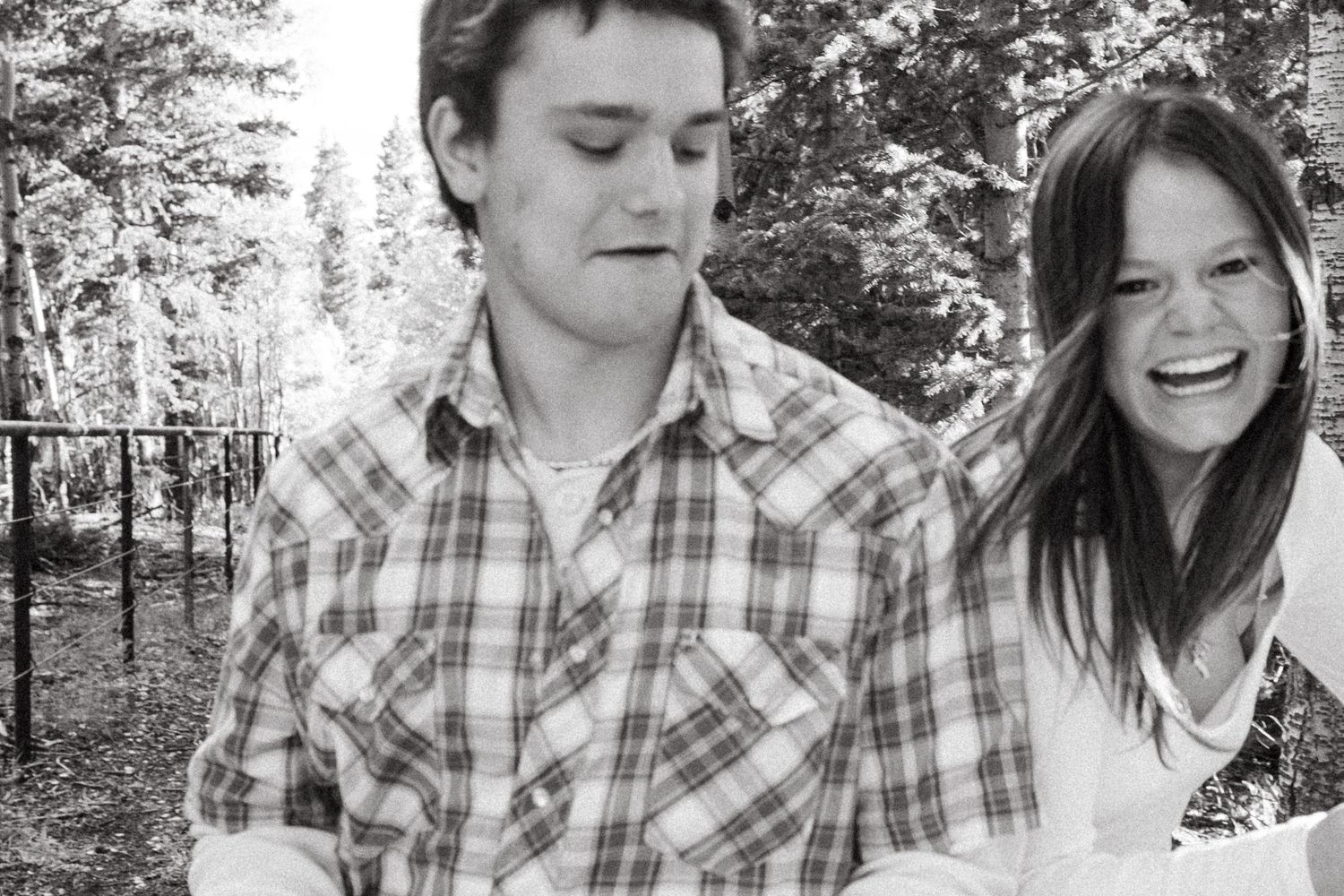 Playful portrait of siblings in forest near Colorado national park.