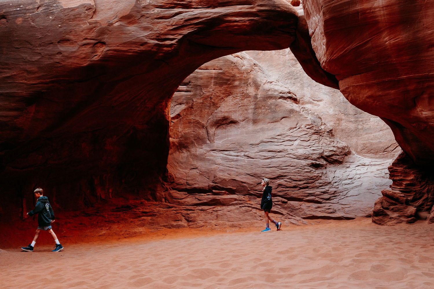 Denver photographer's project 365, May, children walking under arch at Arches National Park.