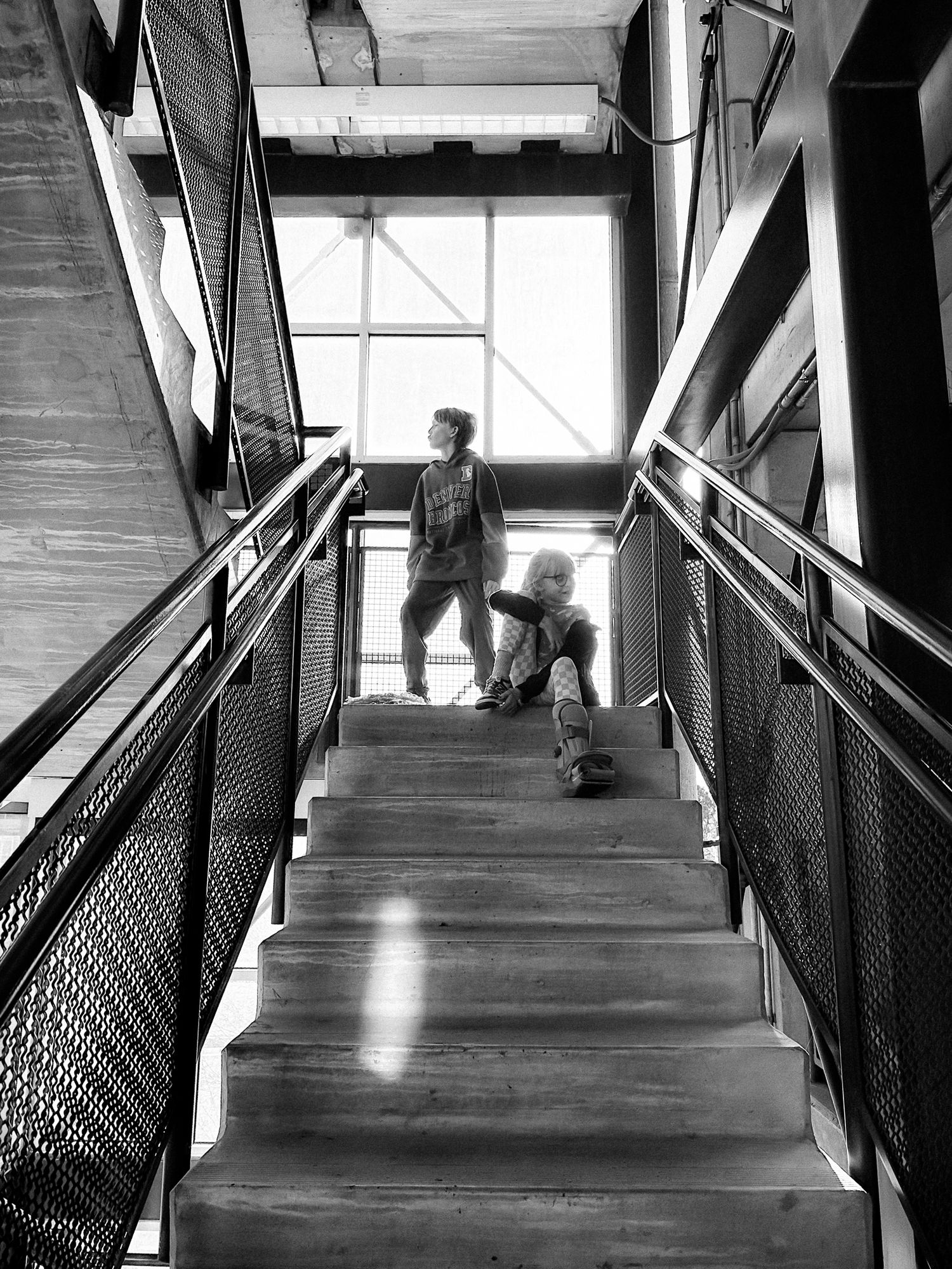 Project 365 - kids on steps of multi floor garage.