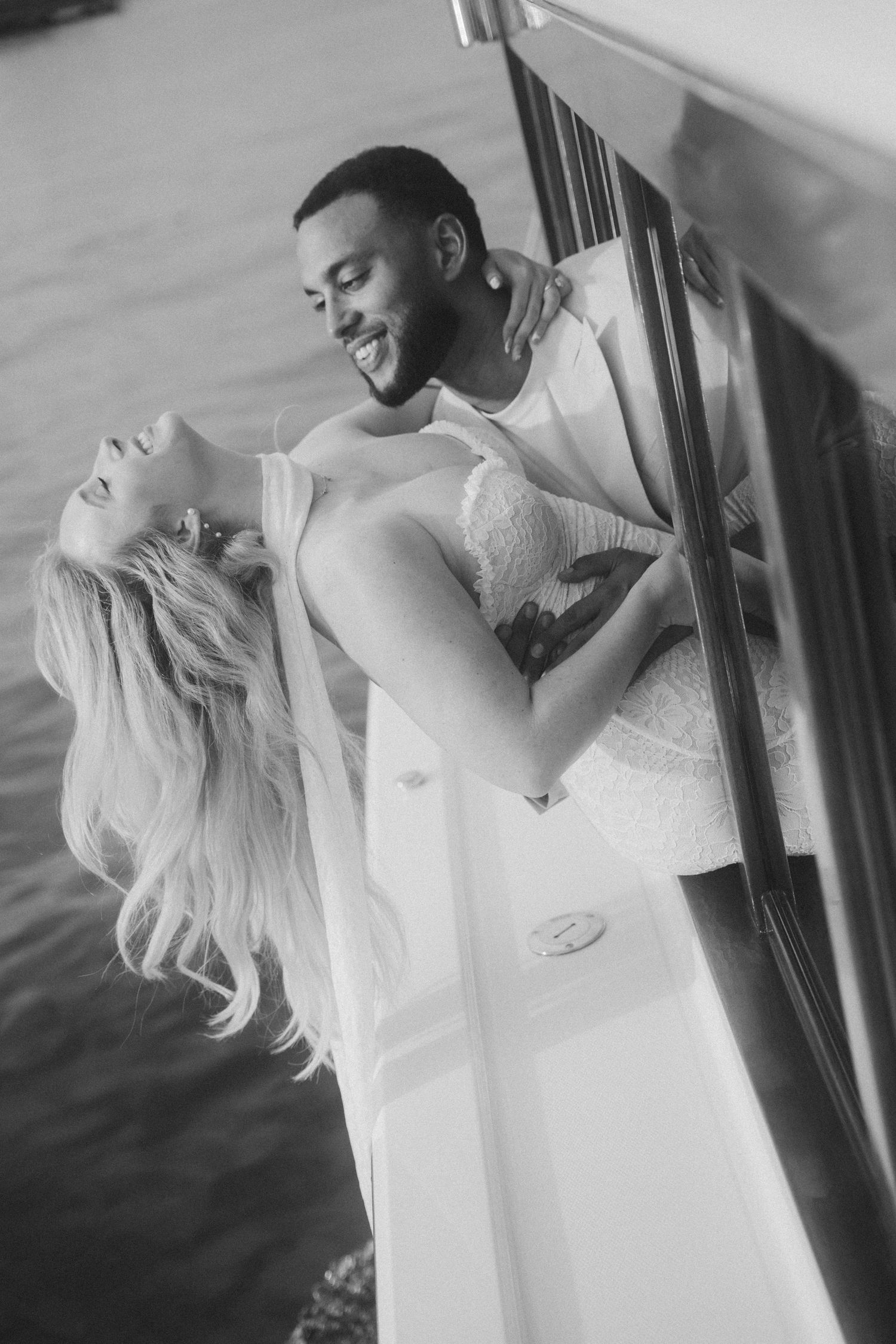 A black and white wedding photoshoot showing intimate moments between the newlyweds.