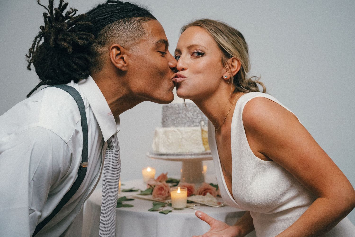 Intimate close-up sequence of a couple sharing romantic moments against a grey background.
