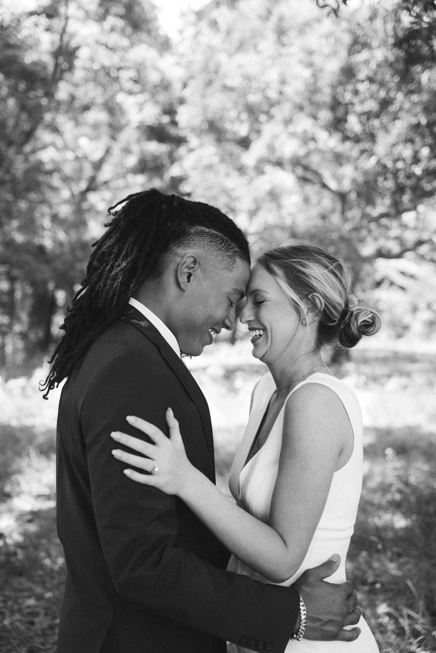 Black and white wedding photo sequence showing intimate moments between newlyweds in a garden.