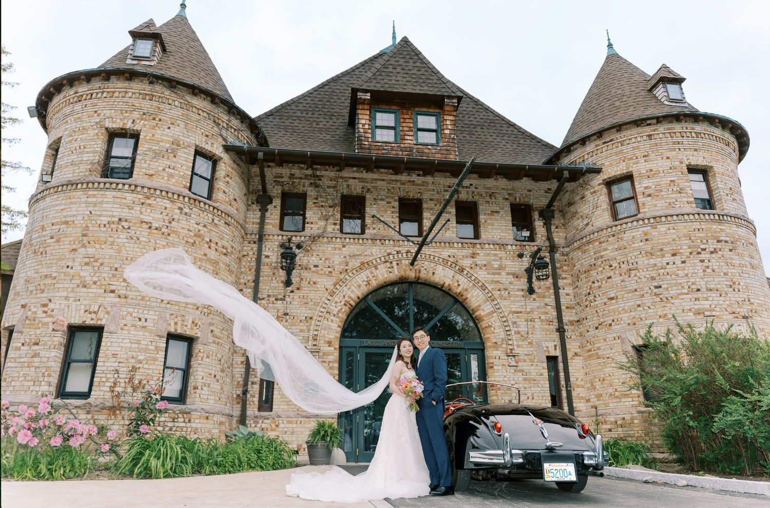 Cathy and Vincent celebrating at Aldrich Mansion beside a vintage car — Boston wedding photographer Helen Fang Studio