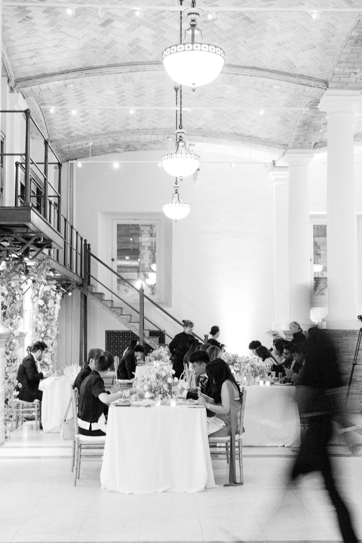 Wedding guests in motion inside Boston Public Library — Boston wedding photography by Helen Fang Studio