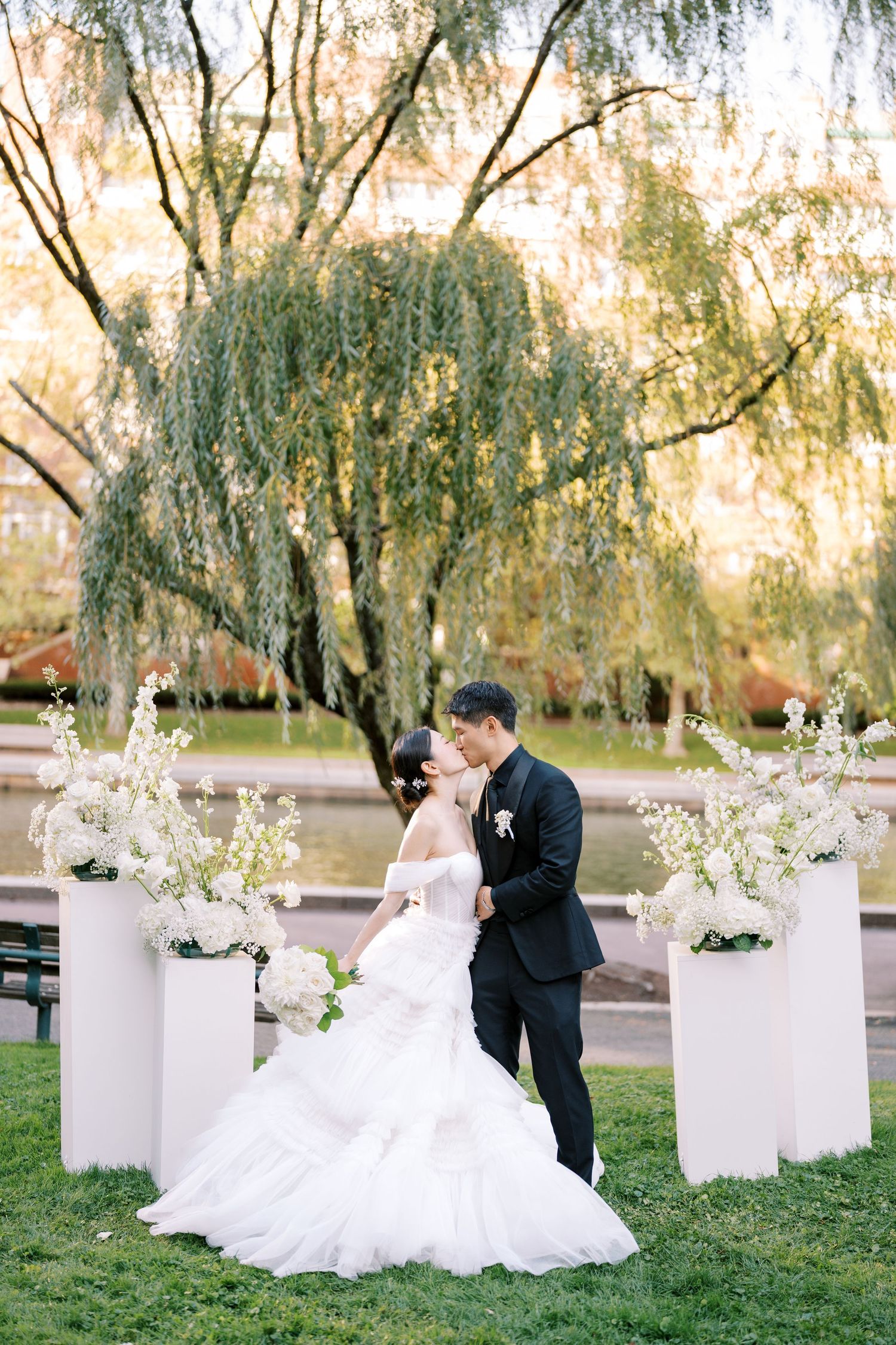 Wedding couple portrait under weeping willow trees at a New England garden venue — Helen Fang Studio wedding photography