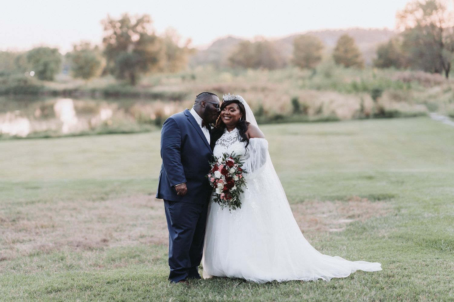 Elegant wedding portrait with mountain landscape in background.