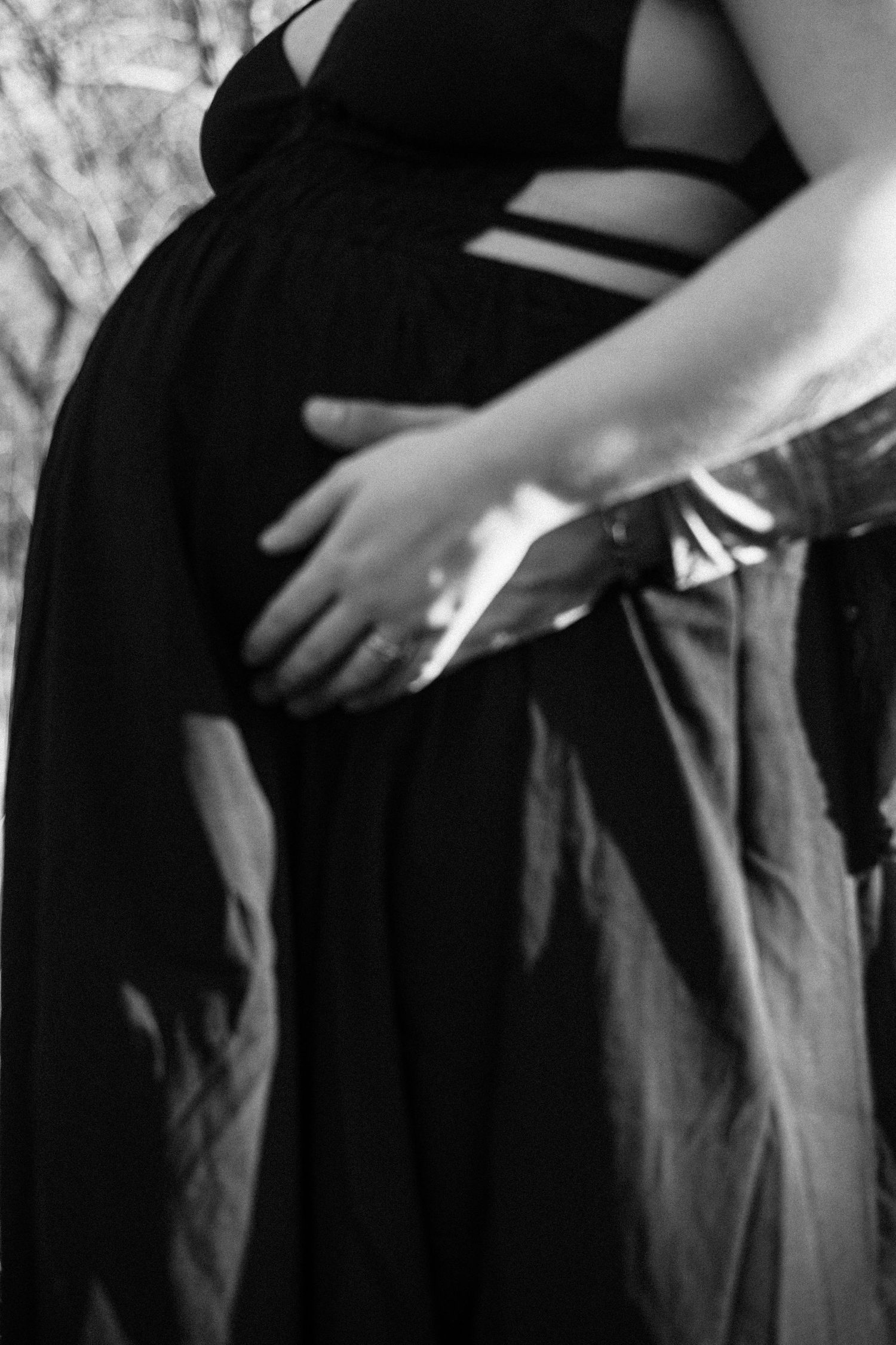 A sequence of black and white images showing hands reaching into a pocket in a close-up view.