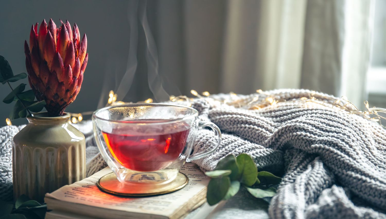 Hot cup of tea in cozy room
