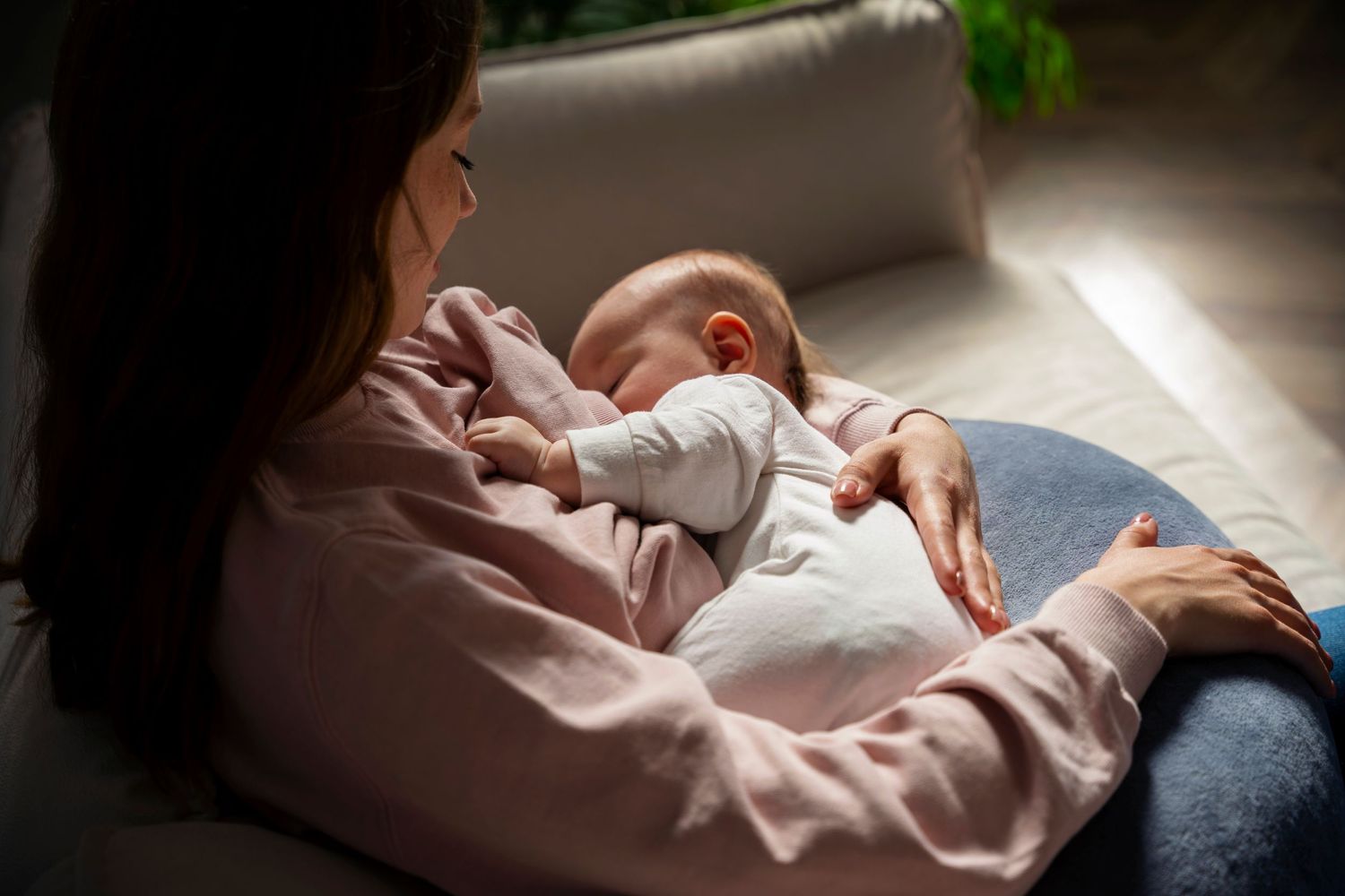 High angle of mother breast feeding newborn