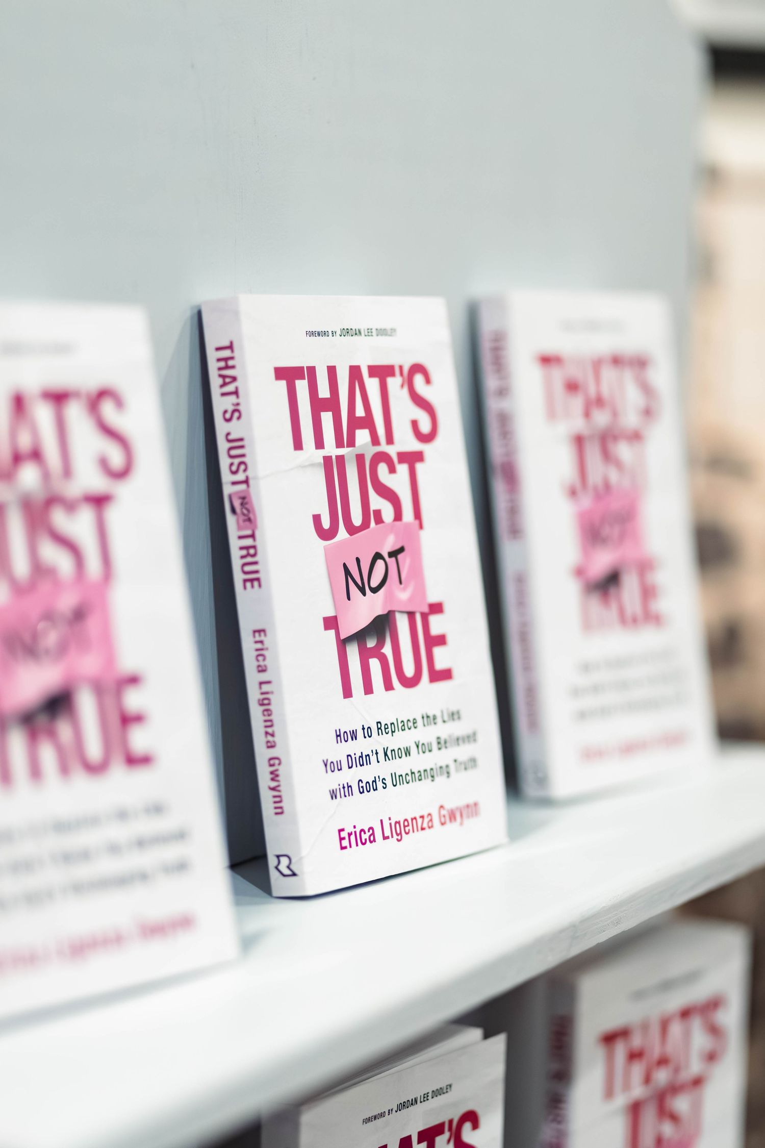 Books titled That's Just Not True by Erica Ligenza Gwynn displayed on a shelf.